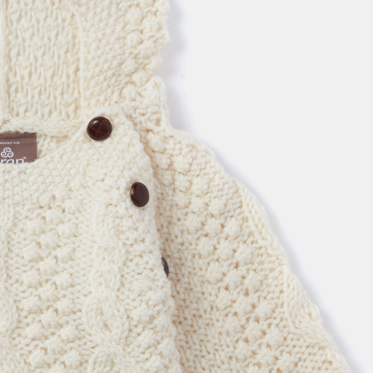 Maglioncino Aran Baby con cappuccio in Lana Irlandese lavorata a mano